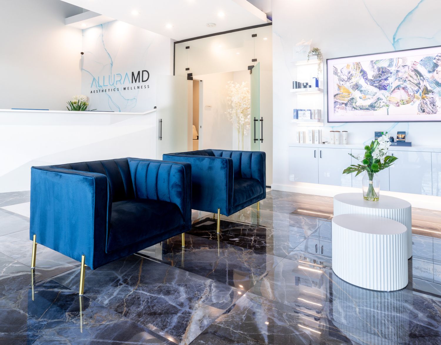 Modern aesthetic clinic waiting area with blue chairs.