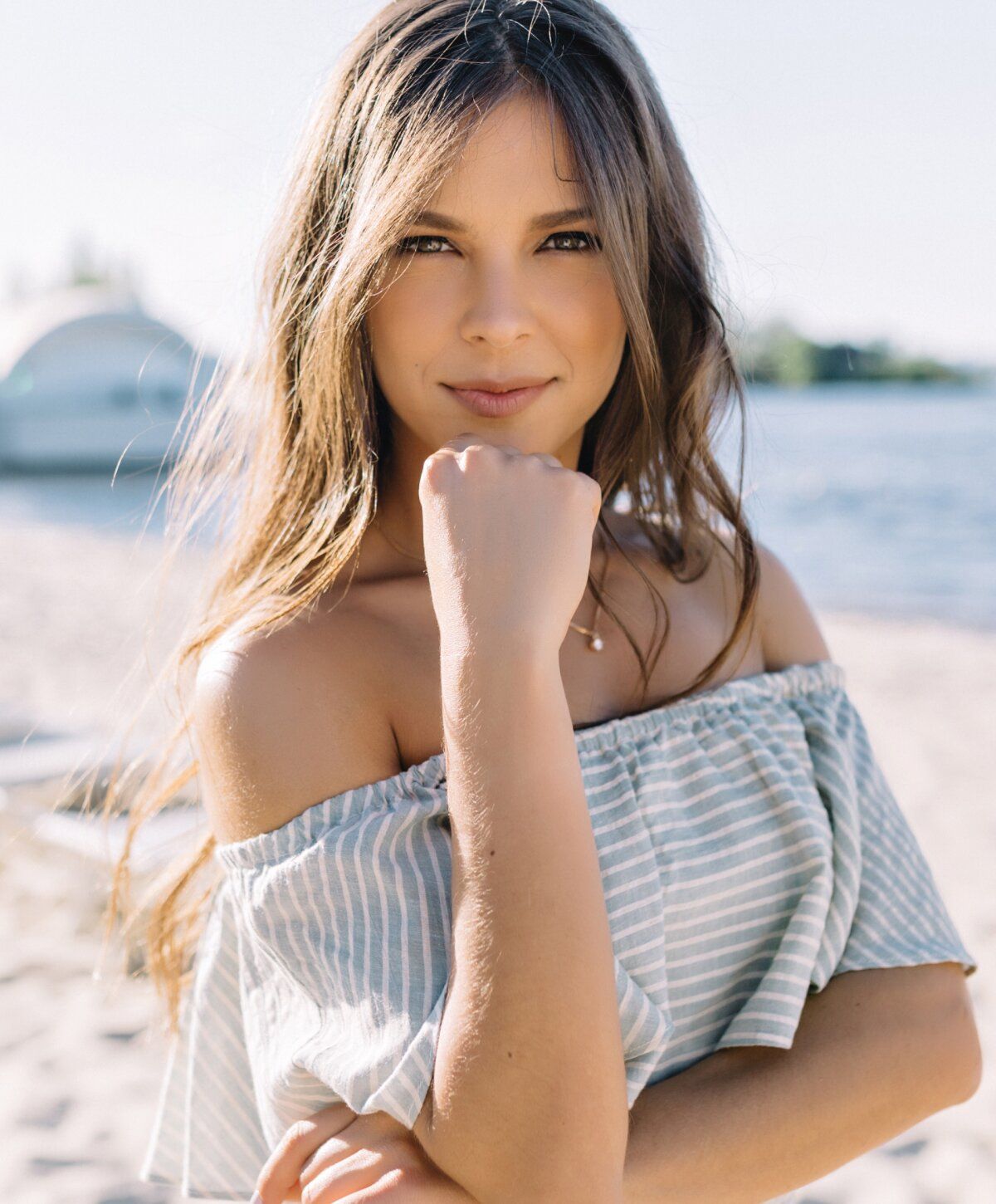 iv therapy patient model with long brown hair at a beach