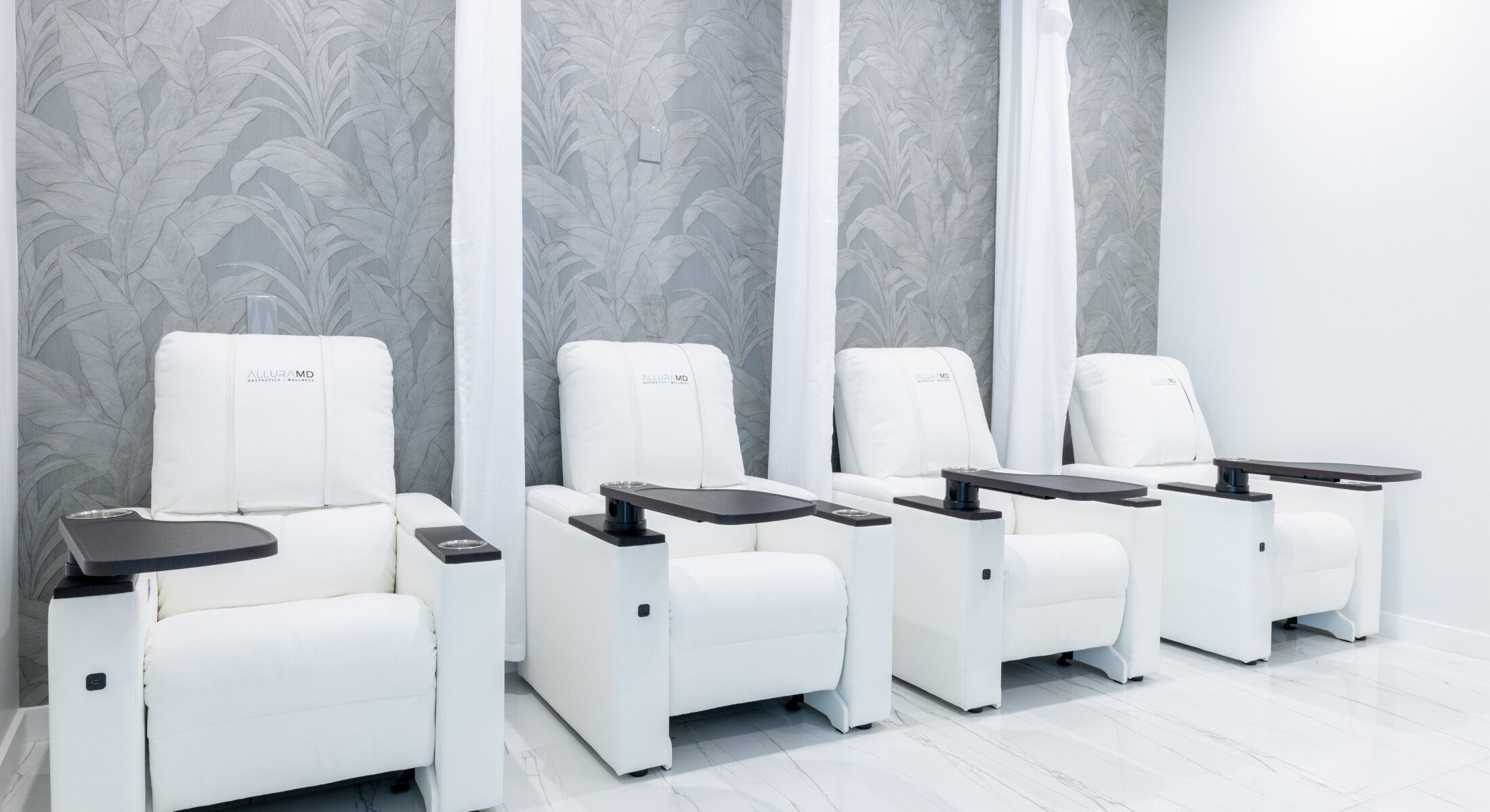 Modern spa chairs in a tranquil setting.