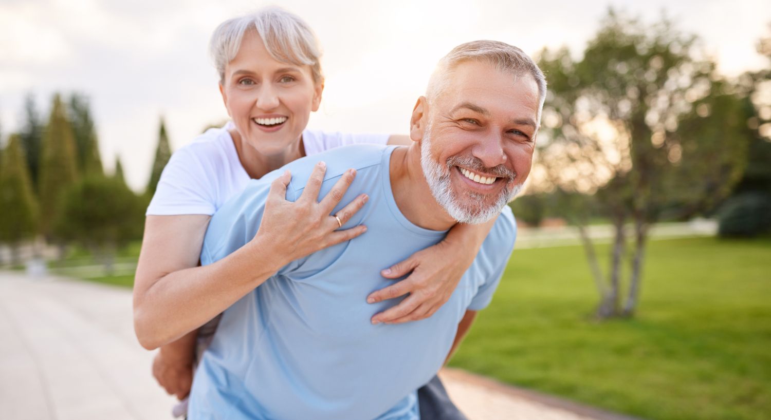 Dihexa patient models embracing and smiling at a park